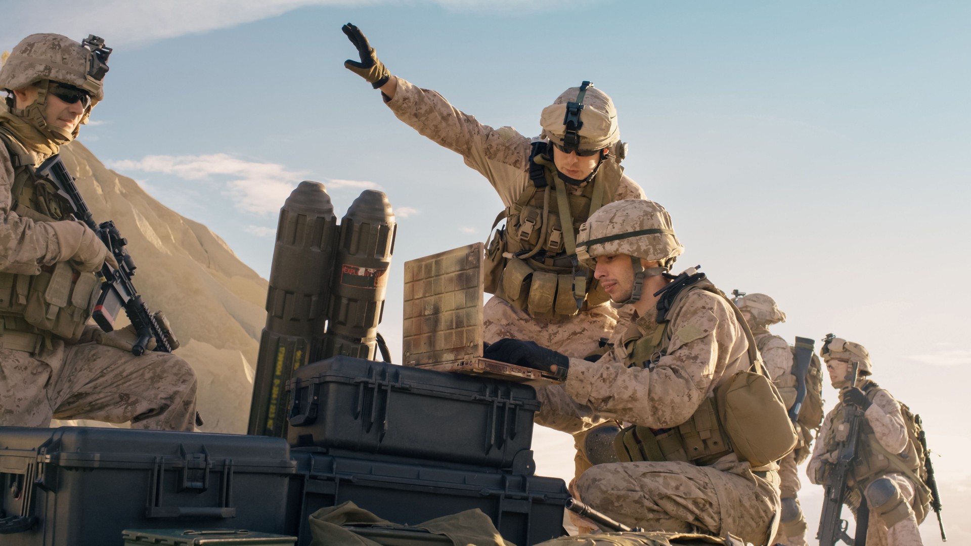 Soldiers are Using Laptop Computer for Surveillance During Military Operation in the Desert.